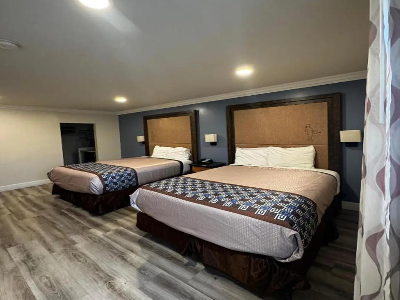 Spacious Friendship Motor Inn guest room with two beds