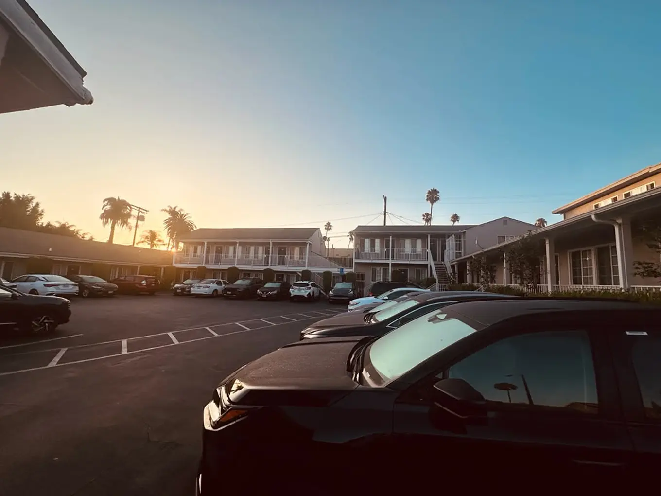 Friendship Motor Inn exterior and parking area in the evening